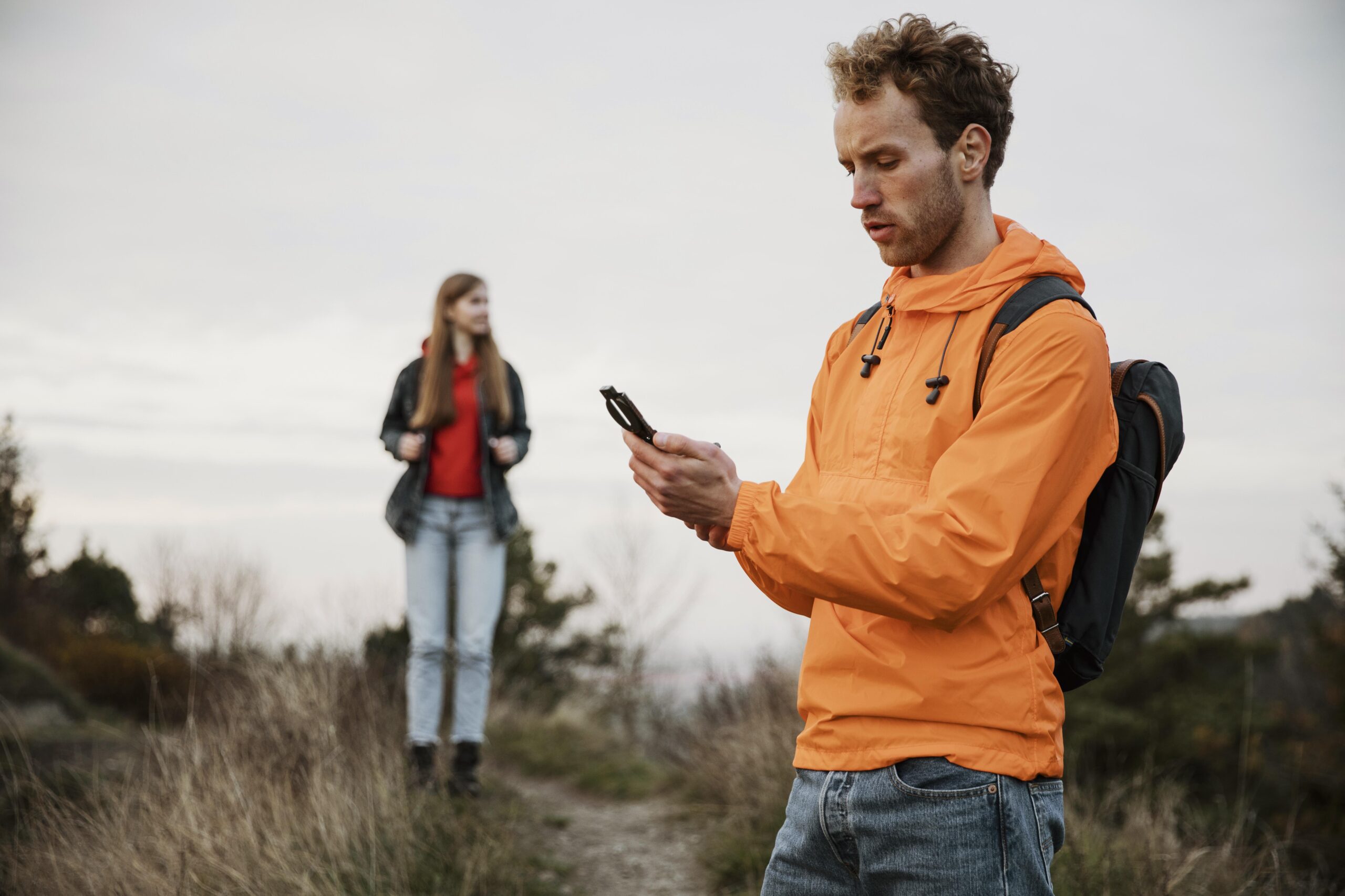 Walker using a GPS device to plan an outdoor route